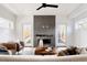 Bright living room with modern fireplace and lots of natural light at 3437 W 17Th Ave, Denver, CO 80204