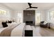 Bright and cozy bedroom with a modern fireplace, neutral color tones and lots of natural light at 3437 W 17Th Ave, Denver, CO 80204
