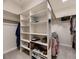 Well-organized walk-in closet with custom shelving, hanging rods, and mirrored accents at 5441 Twilight Way, Parker, CO 80134