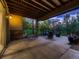 Spacious patio with outdoor seating and a view of the landscaped backyard with mature trees at 5441 Twilight Way, Parker, CO 80134