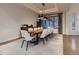 Elegant dining room featuring a large table and modern pendant lighting at 5441 Twilight Way, Parker, CO 80134