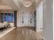 Bright foyer with hardwood floors and stylish chandelier lighting at 5441 Twilight Way, Parker, CO 80134