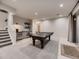 Recreation room with a ping pong table, wet bar, and staircase at 5441 Twilight Way, Parker, CO 80134