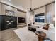 Stylish living room with fireplace, built-ins, and scenic outdoor views at 5441 Twilight Way, Parker, CO 80134