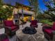 Inviting patio with comfortable seating, a fire pit, and a view of the home's exterior at 5441 Twilight Way, Parker, CO 80134