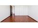 Bedroom view showcasing beautiful hardwood floors and a closet at 9150 E Center Ave # 9C, Denver, CO 80247
