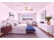 This bedroom is spacious and bright, with modern finishes, ceiling fan, and a large window at 9150 E Center Ave # 9C, Denver, CO 80247