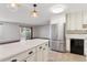 Open concept: view of the kitchen featuring a stainless steel refrigerator and breakfast bar at 9150 E Center Ave # 9C, Denver, CO 80247