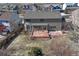 Aerial view of home featuring backyard with patio, mature trees, and privacy fence at 11730 Crow Hill Dr, Parker, CO 80134