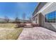 Backyard featuring a brick and stamped concrete patio, with access to the house and the backyard at 11730 Crow Hill Dr, Parker, CO 80134