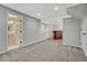 Spacious basement with carpet, recessed lights, and convenient access to a bathroom and bar at 11730 Crow Hill Dr, Parker, CO 80134