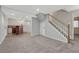 Finished basement area with stairs, carpet, and a bar for entertaining at 11730 Crow Hill Dr, Parker, CO 80134