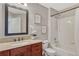 Charming bathroom featuring a vanity with granite countertop, and tub with shower at 11730 Crow Hill Dr, Parker, CO 80134