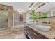 Elegant primary bathroom featuring double vanity, walk-in shower, and soaking tub at 11730 Crow Hill Dr, Parker, CO 80134