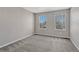 Neutral bedroom offering natural light with carpet floors and two windows at 11730 Crow Hill Dr, Parker, CO 80134