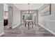 Elegant dining room with a chandelier, hardwood floors, and ample natural light through the bay window at 11730 Crow Hill Dr, Parker, CO 80134
