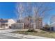Charming two-story brick home featuring a spacious driveway and a well-manicured front yard at 11730 Crow Hill Dr, Parker, CO 80134