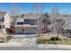 Charming two-story brick home featuring a spacious driveway and a well-manicured front yard at 11730 Crow Hill Dr, Parker, CO 80134