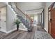 Beautiful foyer showcasing hardwood floors, staircase, and a glimpse into the living spaces at 11730 Crow Hill Dr, Parker, CO 80134
