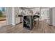Well-appointed kitchen with a central island, granite countertops, stainless steel appliances, and views to the patio at 11730 Crow Hill Dr, Parker, CO 80134