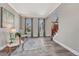 Inviting living room featuring hardwood floors, neutral paint, and views of the entry and staircase at 11730 Crow Hill Dr, Parker, CO 80134