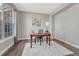 Bright home office featuring a wooden desk, comfortable chair, large window, and a cozy rug for a productive workspace at 11730 Crow Hill Dr, Parker, CO 80134