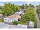 Aerial view of a home with a fenced backyard, covered patio, and mature trees at 2767 S Linley Ct, Denver, CO 80236