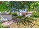 Green backyard featuring a storage shed, patio, and a privacy fence at 2767 S Linley Ct, Denver, CO 80236