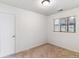 Bedroom featuring neutral carpet, white walls, window and a closet at 2767 S Linley Ct, Denver, CO 80236
