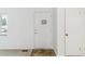 Bright entryway with a textured door, neutral walls and carpet at 2767 S Linley Ct, Denver, CO 80236