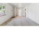 Spacious living room with neutral carpet, bright natural light, and an open layout at 2767 S Linley Ct, Denver, CO 80236