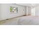 Spacious living room with neutral carpet, bright natural light, and an open layout at 2767 S Linley Ct, Denver, CO 80236