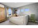 Bedroom showcases three windows for bright light and serene, airy atmosphere at 12187 S Hidden Trail Ct, Parker, CO 80138