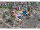 Aerial view of the community pool, splash pads, and playground, surrounded by scenic landscapes at 12187 S Hidden Trail Ct, Parker, CO 80138