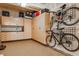 Organized garage with custom cabinets and bike rack system at 12187 S Hidden Trail Ct, Parker, CO 80138