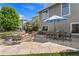 Backyard patio with a fire pit, outdoor seating, and dining area at 12187 S Hidden Trail Ct, Parker, CO 80138