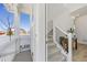 Bright foyer with a staircase that leads to the second story. View to the front porch at 1917 S Fultondale Way, Aurora, CO 80018