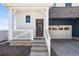 Inviting front porch with a decorative wreath, stairs, and a white railing at 1917 S Fultondale Way, Aurora, CO 80018