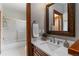 This bathroom features a granite countertop, undermount sink, and a shower/tub at 9009 Rambling Oak Pl, Parker, CO 80134