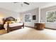 Bright bedroom with large windows, neutral carpet, and a comfortable king-size bed at 9009 Rambling Oak Pl, Parker, CO 80134