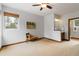 This spacious bedroom has an ensuite bathroom, big window, and nice bench seating at 9009 Rambling Oak Pl, Parker, CO 80134