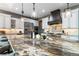 Gourmet kitchen with granite countertops, stainless steel appliances, and a large island at 9009 Rambling Oak Pl, Parker, CO 80134