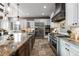 Spacious kitchen with stainless steel appliances and large island at 9009 Rambling Oak Pl, Parker, CO 80134