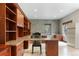 Basement home office with custom built in cabinets, lots of counter space, and natural lighting at 9009 Rambling Oak Pl, Parker, CO 80134