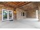Covered outdoor patio with stone accents provides a shaded space for relaxation at 9009 Rambling Oak Pl, Parker, CO 80134