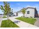 Charming home with a well-maintained lawn, two car garage, concrete driveway, and inviting curb appeal at 819 Sunflower Dr, Brighton, CO 80601