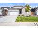 Charming single-Gathering home with a well-maintained lawn, two car garage, and inviting curb appeal at 819 Sunflower Dr, Brighton, CO 80601