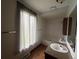 Bright bathroom features a tub, window with curtains, and vanity with sink at 1943 Meadow Dr # B2, Longmont, CO 80501