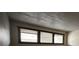 Bedroom featuring a row of three windows with blinds for natural light at 1943 Meadow Dr # B2, Longmont, CO 80501
