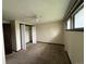 Bedroom with closet and large window, offering ample space and natural light at 1943 Meadow Dr # B2, Longmont, CO 80501